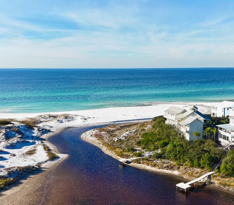 Aerial view of Blue Mountain Beach coastal dune lake meeting the Gulf