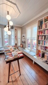 Cozy independent bookstore interior with shelves of books