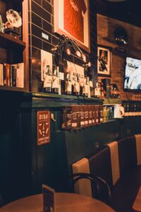 Warmly lit bar interior with vintage decor and ambient lighting